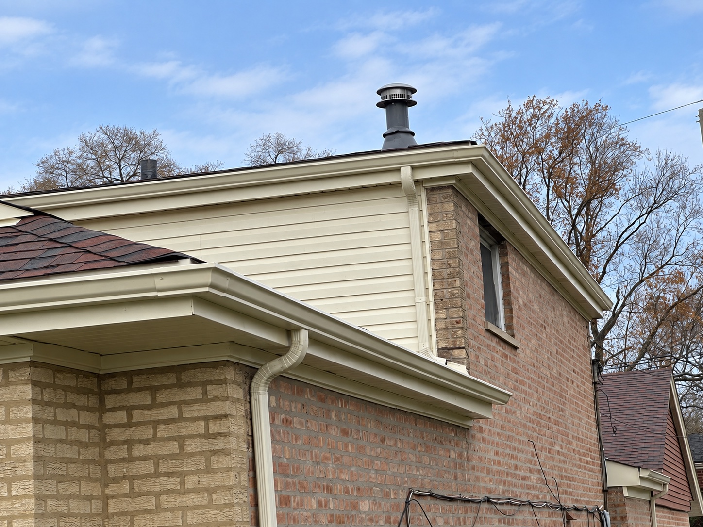 New gutters, fascia and soffit at the edge of a completed roof