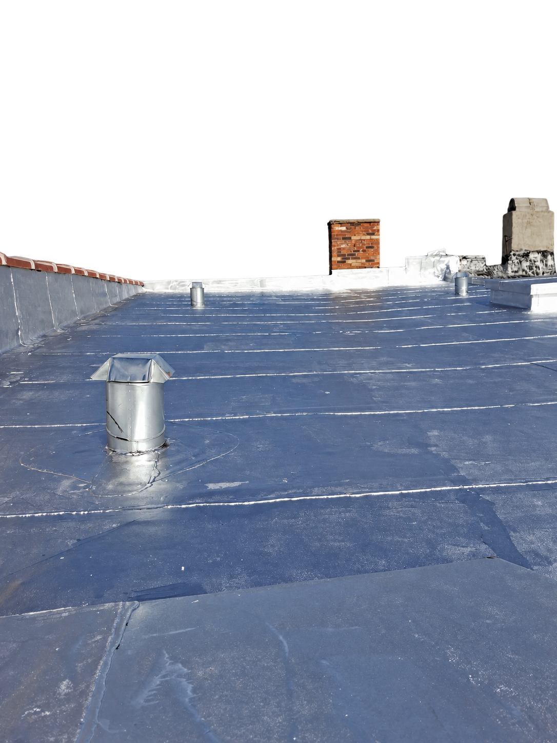 Completed silver-coated Chicago flat roof isolated to show the roof field, penetrations and parapet